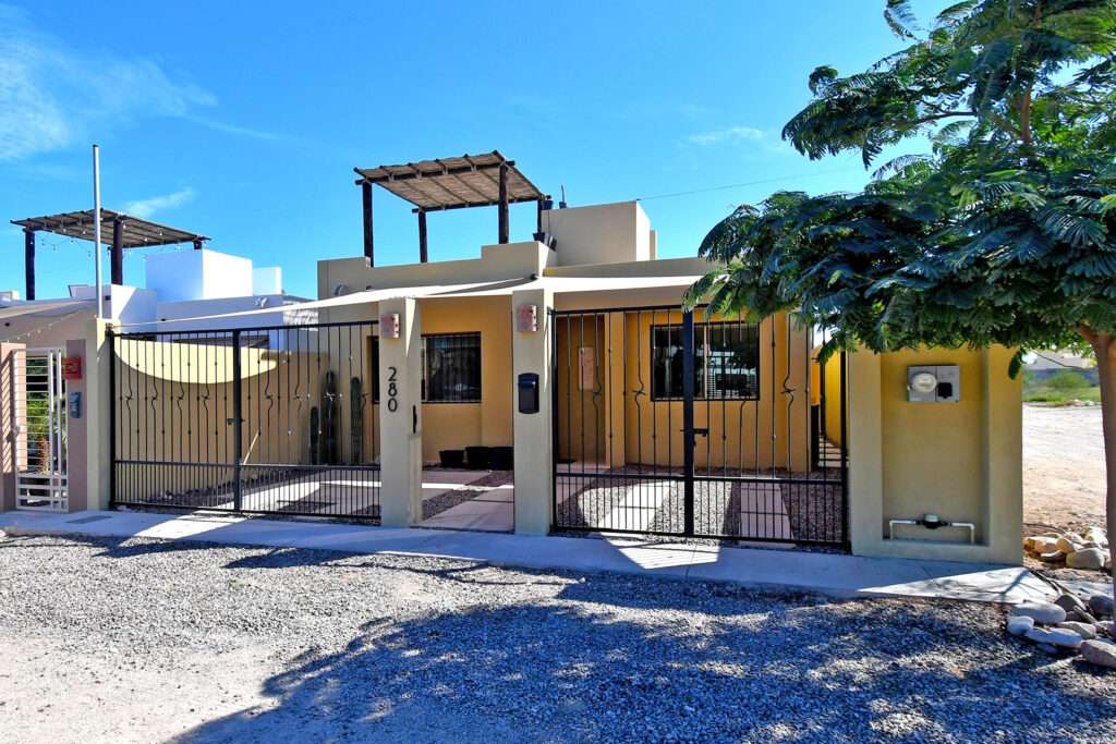 La Paz Bellavista Beautiful and cozy two-story house with a contemporary design in Bellavista Plus, La Paz. Built on a 122.5 m² lot with 181.5 m² of construction. Excellent location near shopping centers, banks, hospitals, schools, restaurants, and main roads. Features on the ground floor: open-concept living-dining area, beautiful kitchen, two bedrooms (one master), two full bathrooms, patio with pool and palapa, and service area. Upstairs: spacious master bedroom with large walk-in closet and private bath, plus an extra room ideal as an office or bedroom. Includes pool with pump room, covered garage with electric gate, water pressure system, cistern, and minisplits. Recently painted and waterproofed--ready to move in! – 8 Calle 15, La Paz, BS