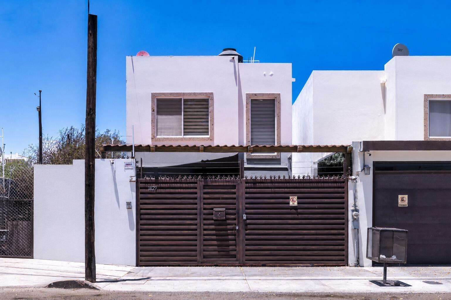 La Paz Centro Beautiful residence located in the heart of the city, within a private, fully walled, and gated community, providing security and peace of mind.The property features a two-car garage with an electric door and is offered fully equipped and furnished, ready to move in or start generating income.One of its greatest attractions is its private pool, perfect for enjoying warm days or as part of a relaxing daily routine in an intimate and inviting setting.The house is distributed over two levels.On the ground floor, you'll find the kitchen, dining room, and living area in an open-concept layout, as well as a bedroom with a full bathroom and access to the patio overlooking the pool. There is also a spacious half-bathroom. Large windows open onto the pool area, allowing for excellent natural light and creating a warm, tranquil, and very pleasant atmosphere.Upstairs, there are three comfortable bedrooms and two full bathrooms, designed to offer comfort and privacy.Each space reflects exquisite taste in decor, where every detail has been carefully selected to create a harmony between style, comfort, and functionality.Furthermore, this property boasts a solid track record of long-term return on investment, making it not only a beautiful residence but also an excellent opportunity for investors seeking a profitable property in a prime location.Price SET in PESOS MXN for sale