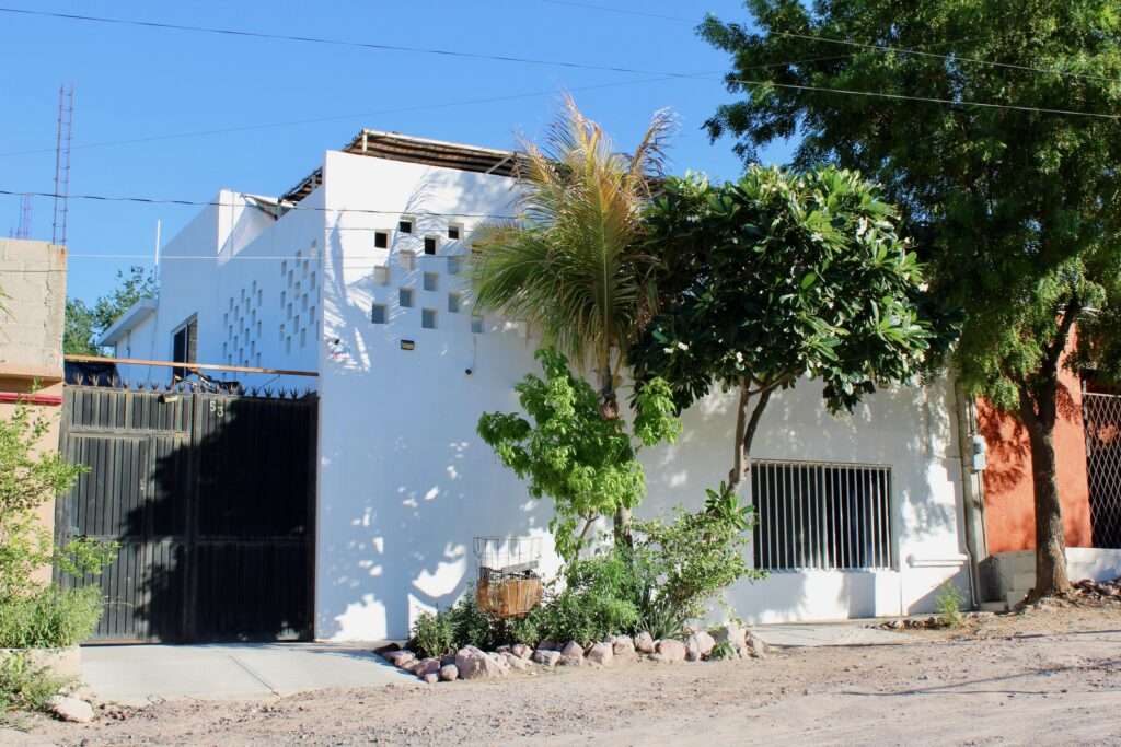 La Paz Esterito This hidden gem features 3 bedrooms and 2 baths downstairs, plus a full 1-bedroom apartment above with its own entrance and large terrace overlooking a soccer field. Behind the house is a covered BBQ area with pool, pilapa, pergola, and bodega. A large enclosed patio provides covered access to the lower level and upstairs apartment with shared washer/dryer. Own a slice of paradise! Property is priced in pesos at 3,990,000. Esta joya escondida cuenta con 3 dormitorios y 2 baños en la planta baja, además de un apartamento completo de 1 habitacion en la planta superior con entrada independiente y una amplia terraza con vistas a una cancha de fútbol. Detrás de la casa hay una zona de barbacoa cubierta con piscina, pilapa, pergola y bodega y patio amplio. Precio - 3,990,000 – 53 Chiapas, La Paz, BS