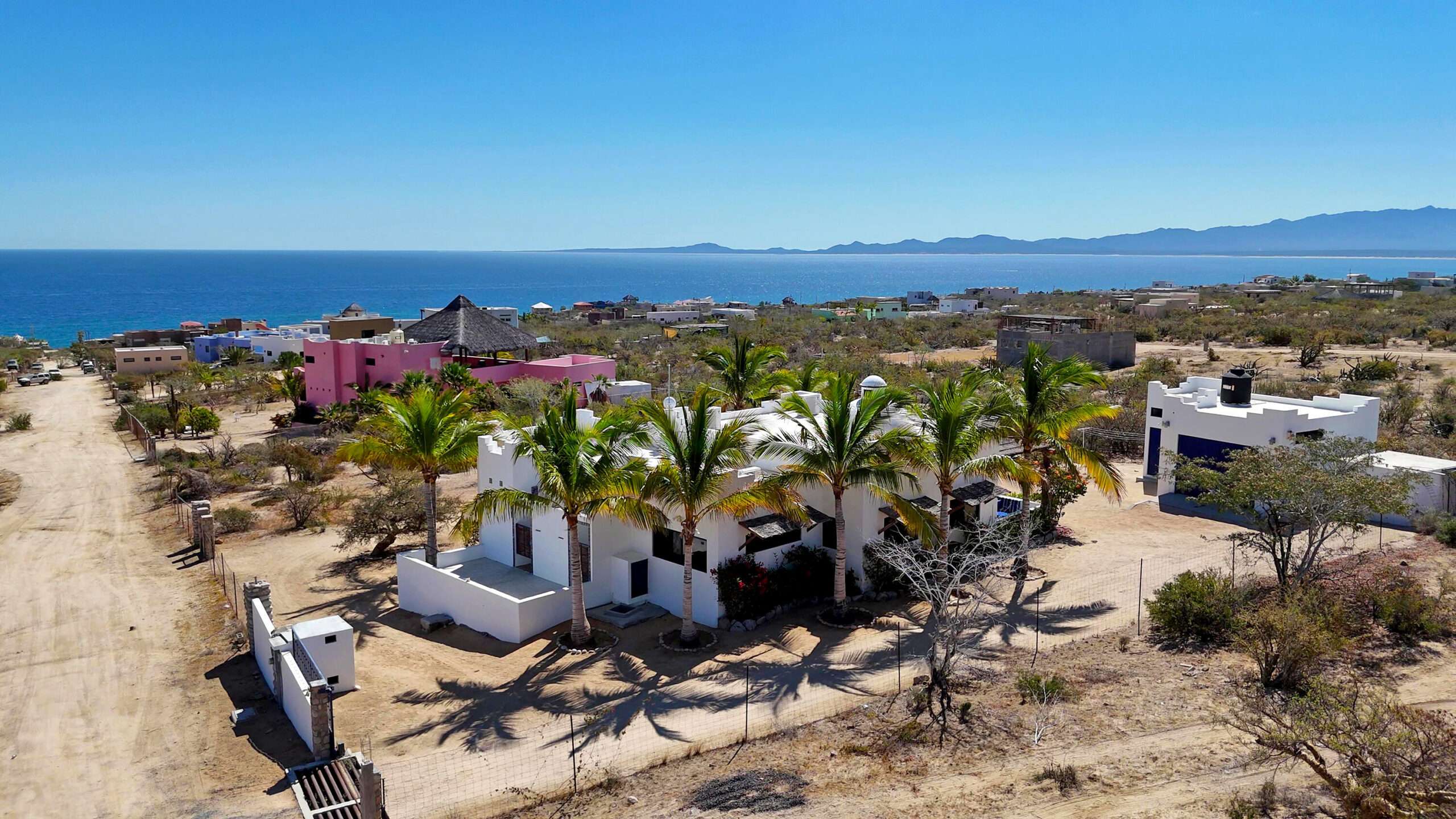 La Paz El Sargento Bright, breezy, and full of Baja charm, this stunning 2-bedroom, 2-bath home offers effortless indoor-outdoor living. The open-concept great room centers around a spacious kitchen island beneath a striking brick cupula, with bold blue cabinetry set against crisp white walls for a fresh coastal feel. Large windows flood the home with natural light and showcase sweeping desert and Sea of Cortes – ., Casa De La Cuera, La Paz, La Paz, BS