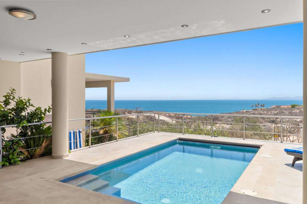 La Paz Paraiso Del Mar Beachside Living in Paraíso del MarNestled within the exclusive gated community of Paraíso del Mar, this beautifully maintained and fully furnished residence offers the perfect blend of comfort, privacy, and coastal living. Situated on an expansive 938 square meter lot, the property features 212.30 m² (2,285 sq.ft.) of air-conditioned living space and approximately 725.13 m² of outdoor living and landscaped areas, providing ample room to relax and entertain. As you enter the property, you are welcomed by a stunning private courtyard surrounded by a decorative perimeter wall. The courtyard features an elegant arched wrought-iron entry gate, a charming fountain, and beautifully designed outdoor spaces that create a warm and inviting first impression.The home's thoughtful design embraces Baja's indoor-outdoor lifestyle. The main entrance includes a custom iron security screen door, allowing you to open both the front door and rear sliding glass doors to enjoy refreshing sea breezes flowing naturally throughout the home.Inside, the residence offers two spacious bedrooms and two full bathrooms, with comfortable living and dining areas designed for easy entertaining. The home is being offered fully furnished, with a few – 35 Bahia San Sebastián Vizcaino, La Paz, BS