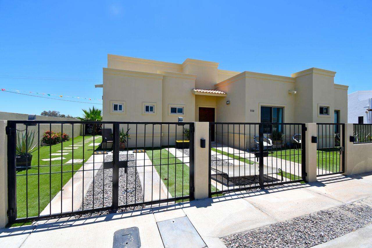 La Paz Portobello Located within the gated, 24/7 guarded community of Portobello, this beautifully maintained 3-bedroom, 3.5-bath home offers the perfect combination of comfort, efficiency, and convenience. Situated on a rare double lot, the fully walled and fenced property provides exceptional privacy with ample room to add a custom pool while still enjoying generous outdoor living space.Designed for easy Baja living, this home makes an ideal full-time residence, vacation home, or investment property. The well-appointed kitchen offers an abundance of counter and storage space. Each of the three spacious bedrooms features its own ensuite bathroom, complemented by a convenient powder room for guests. Additional upgrades include whole-home water filtration, a water softener, and a rooftop terrace with beautiful mountain – 550 benevento via, La Paz, BS