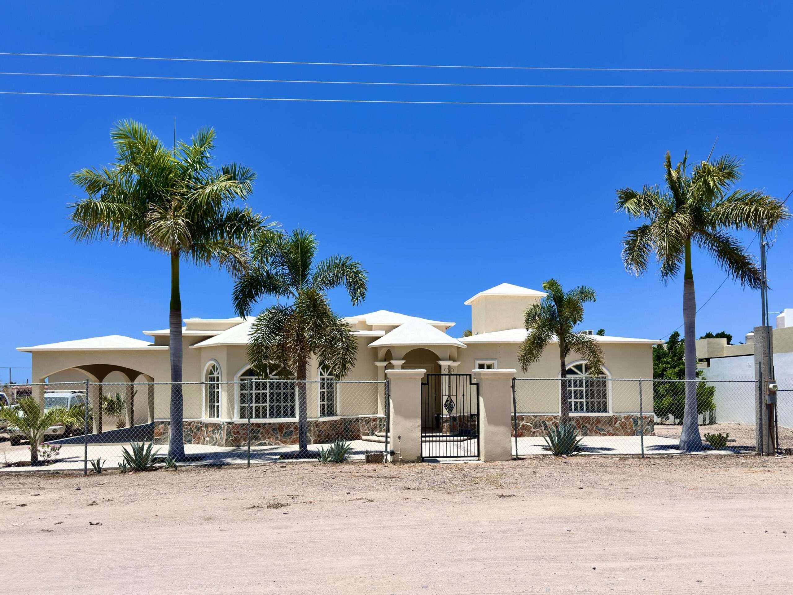 La Paz El Centenario Opportunity awaits on this spacious corner property with over 1,600 m² of land in El Centenario. The property features a 3-bedroom, 2-bath home with ample space offering endless possibilities for future expansion. A detached storage building provides additional flexibility for a workshop, storage, or other uses. The generous lot offers room for guest casitas, a pool, RV parking, landscaped gardens, or other improvements. Conveniently located just one block from the main highway, providing easy access to shopping, restaurants, and the beaches of El Centenario and El Comitán. A great opportunity for buyers seeking space, potential, and a prime location.*The property's zoning allows the rear portion of the lot to be subdivided into an additional lot. – Calle 8, El Centenario, La Paz, BS